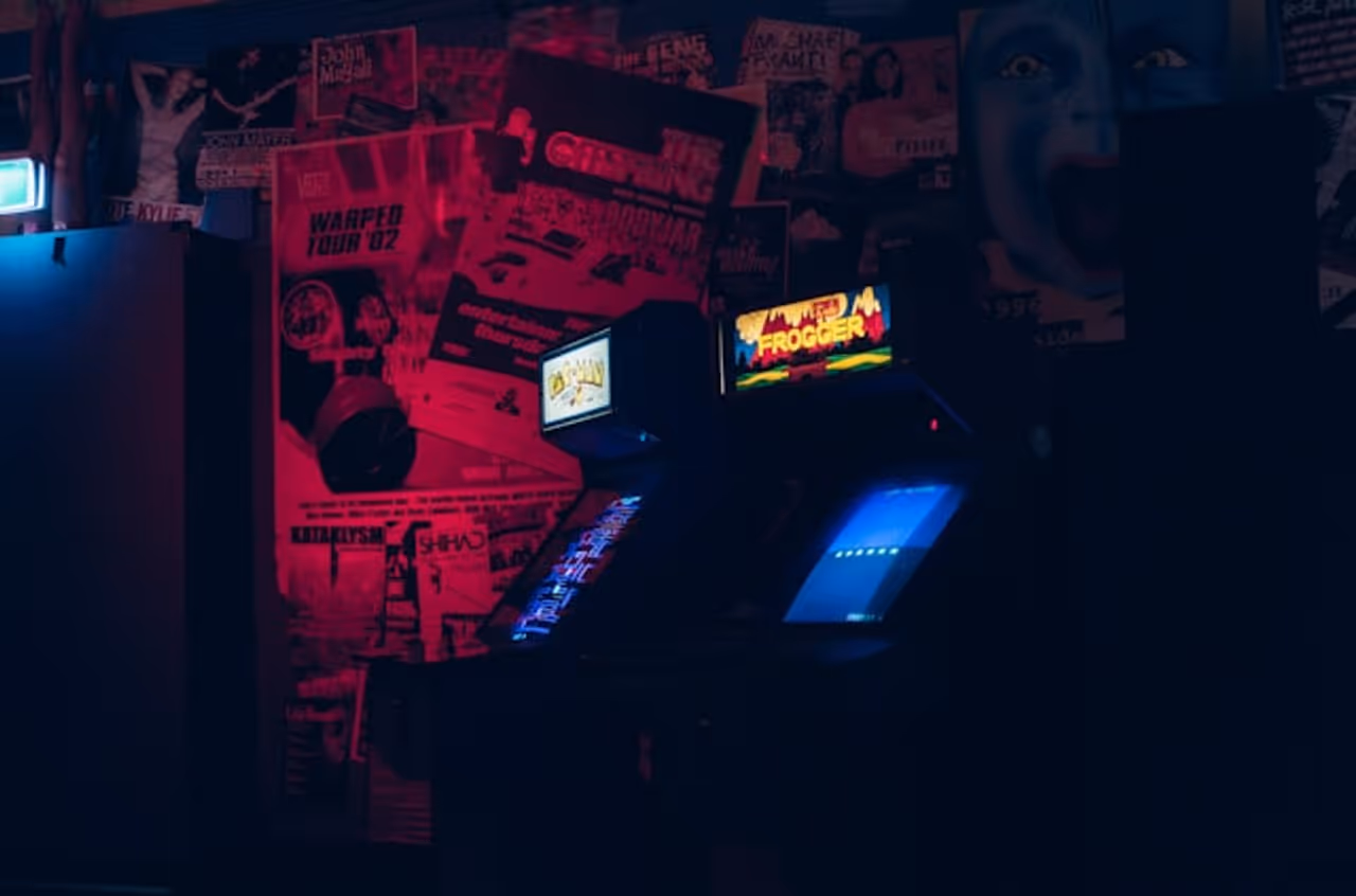 Retro arcade cabinets in dark room